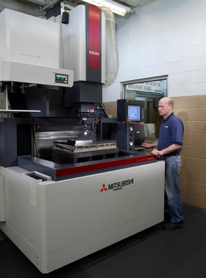 Rodon employee operates a cnc machine